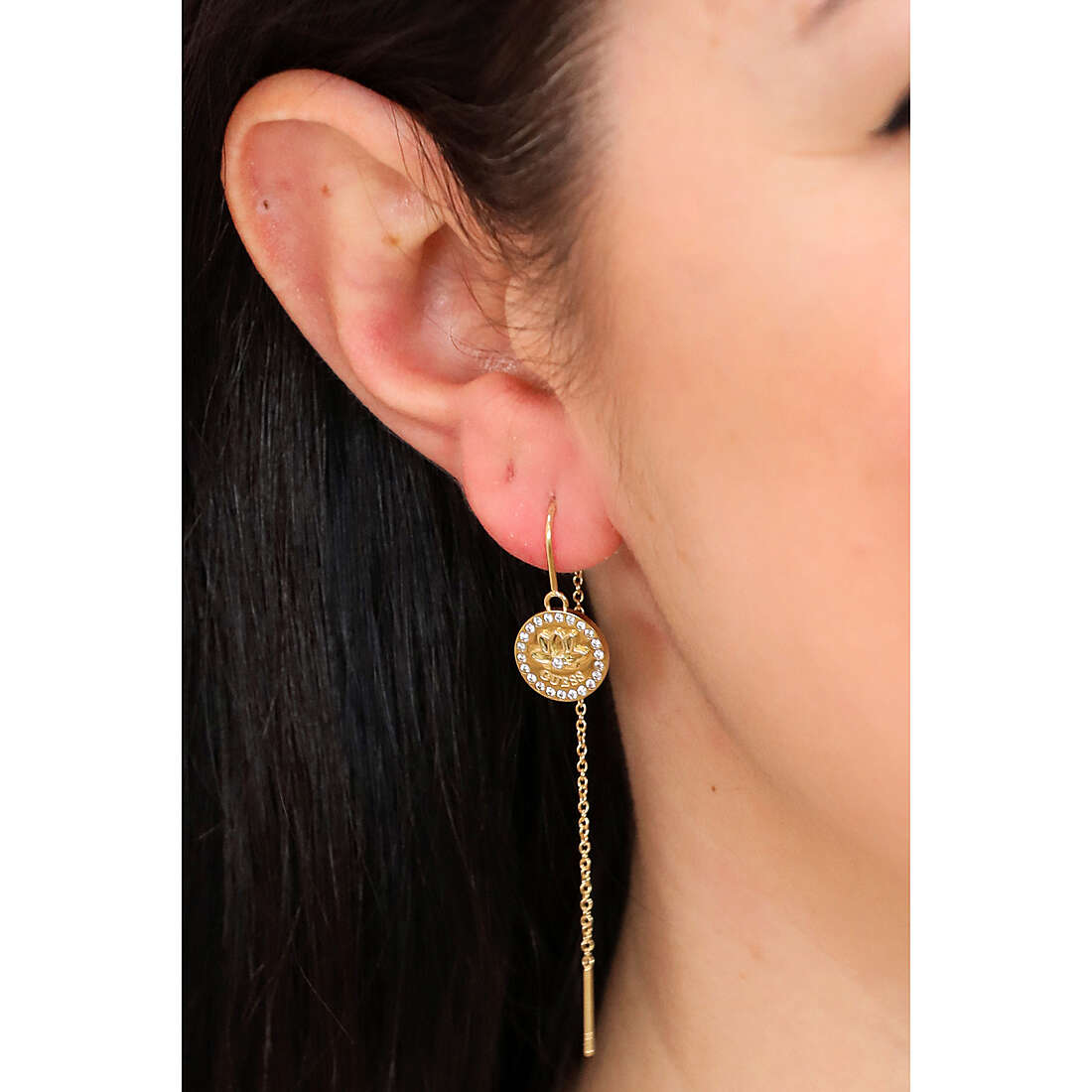 Guess earrings Lotus woman JUBE01345JWYGT/U wearing